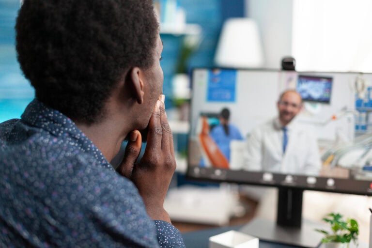 Online healthcare checkup of african american guy